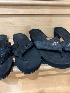 Two pairs of Coach Black and Brown Signature Slide Sandals